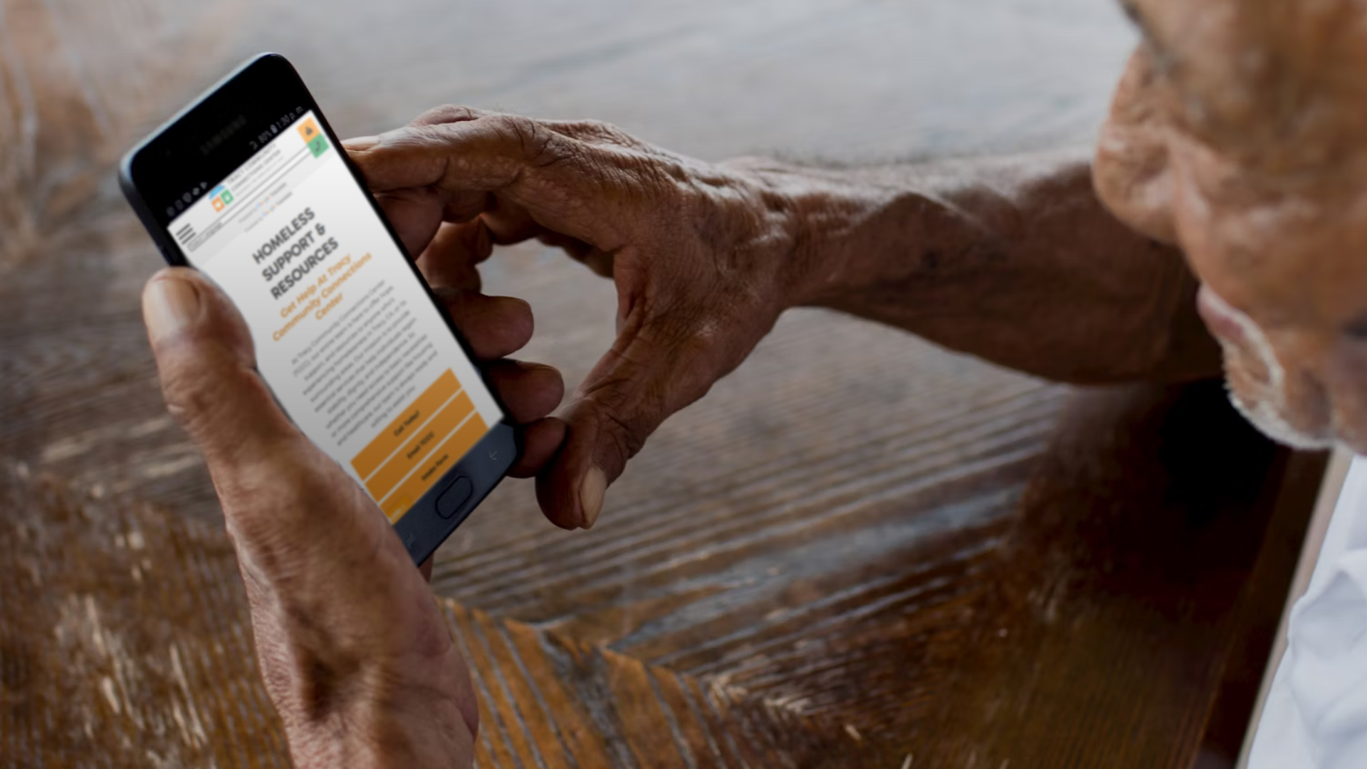 Accessing essential online services on a phone with the help of Tracy Community Connections Center.